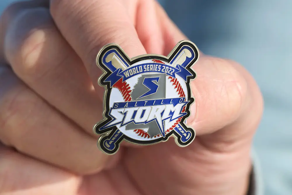 Holding World Series Storm team custom trading pin.